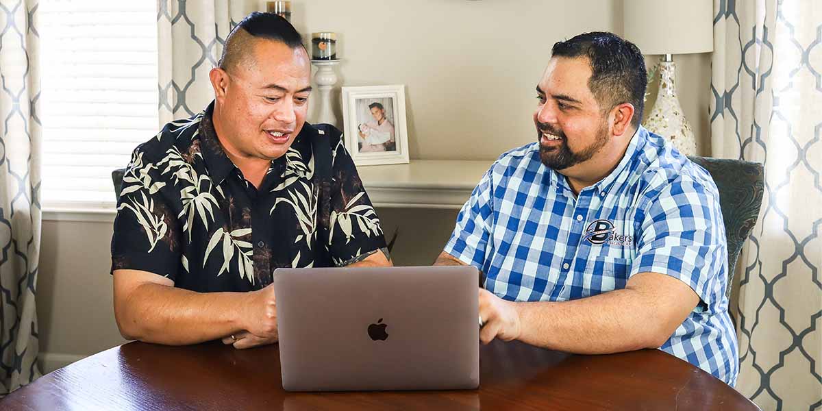 Professional AC installation consultation - Baker's HVAC technician providing free estimate to Lodi CA homeowner