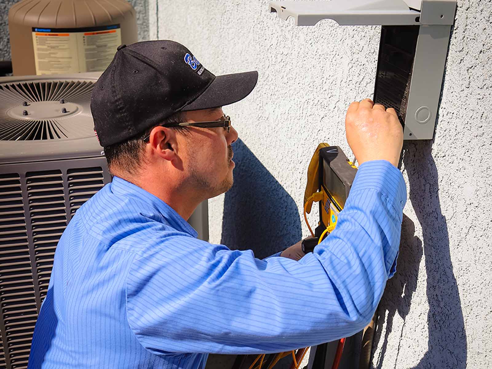 Baker's HVAC technician performing thorough air conditioning inspection in Lodi CA - professional diagnostic service